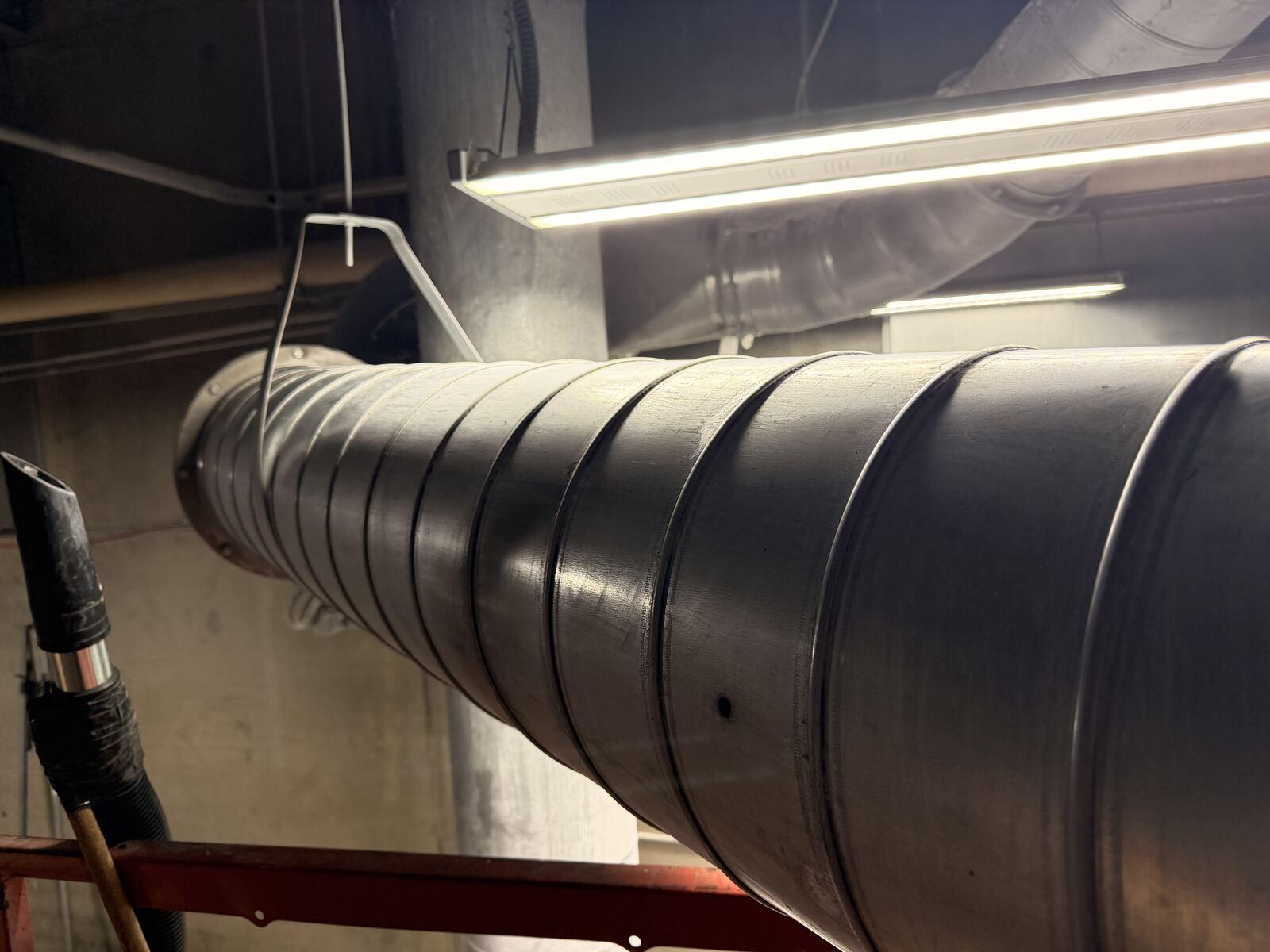 Ductwork cleaned to bare metal after HEPA vacuum remediation